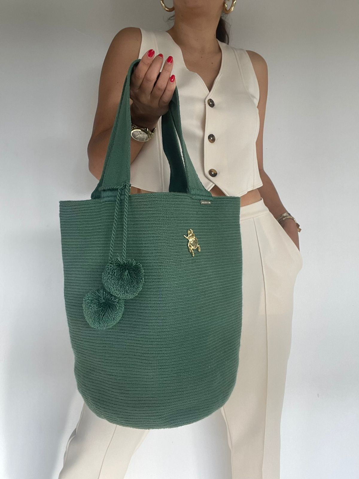 Backpack with Pin and Tassels